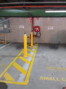 safety bollards installation qld and nsw and linemarking in car park
